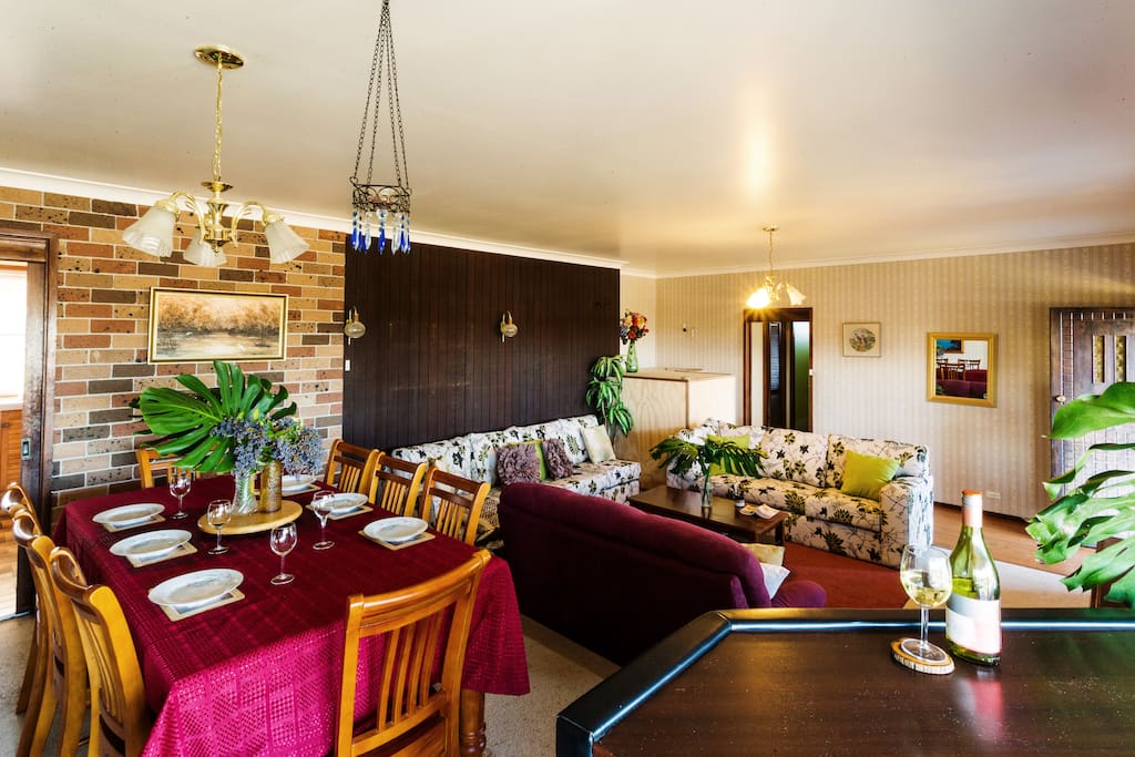 Living Area including digital TV, Blue Ray / DVD Player and Dining Table Setting for Eight
