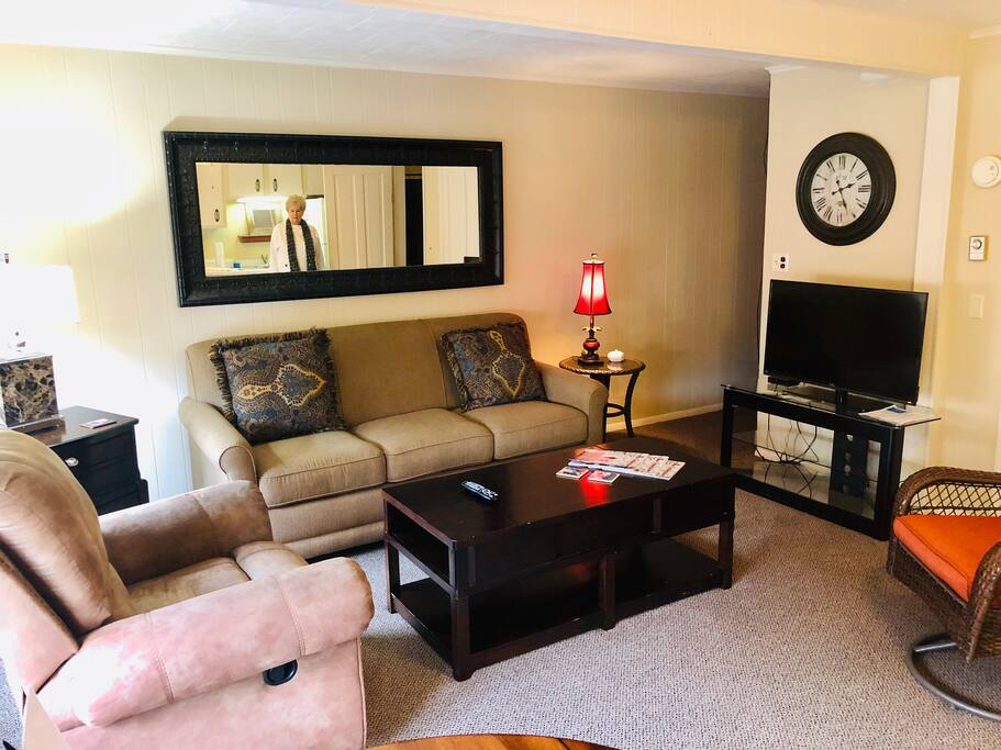 living room with new sleeper sofa, lazy boy reclining chair and swivel chair