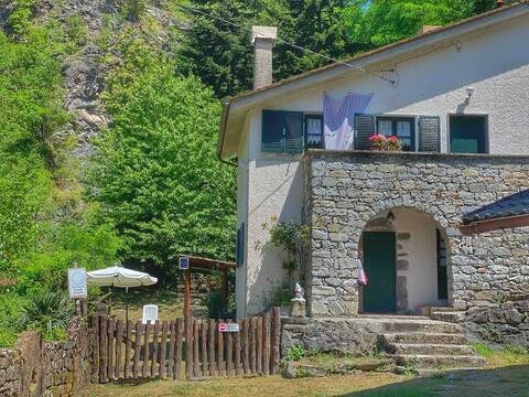 Villa with a stream, wooded garden and fireplace