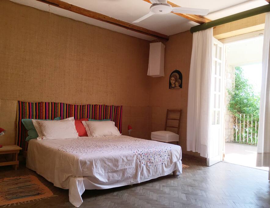 The room is set with 1 double bed and provide a ceiling fan