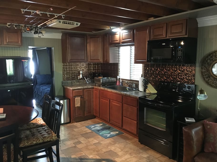 Kitchen with oven, stove, microwave, coffee maker...