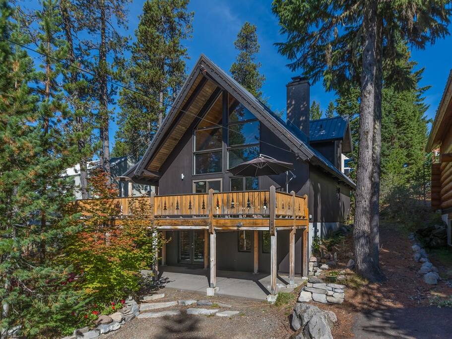 Front of home with large deck for sunbathing and bbq's.