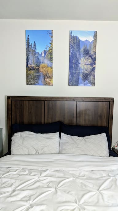Bed frame with Yosemite wall art