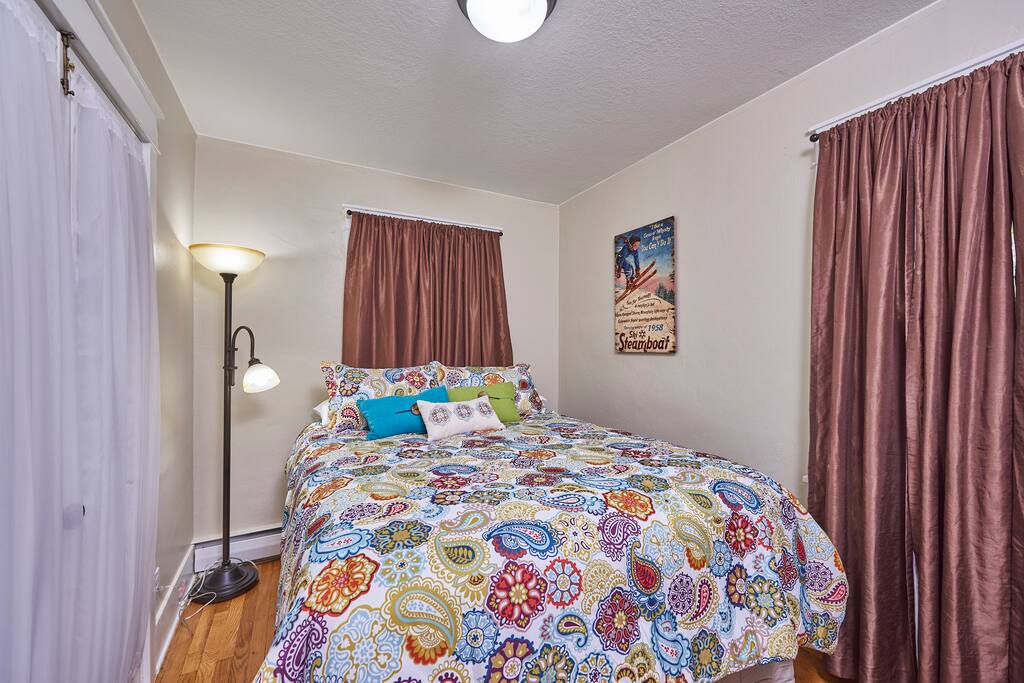 Bedroom with comfy queen sized bed and walk in closet