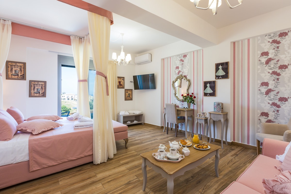 Bedroom on the first floor with a king bed, sitting area and en-suite bathroom