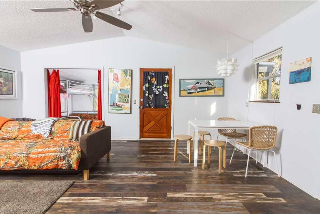 Relive your adventures in our spacious living room! - Bring the whole gang together in our spacious, artwork filled living room.