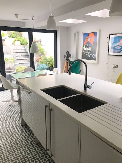 Enjoy a leisurely breakfast in the kitchen flooded with natural sunlight