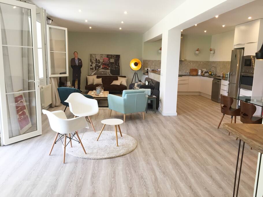 Floor-to-ceiling doors open out onto the porch