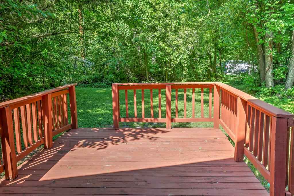 'The Blue House' boasts over 1,300 square feet of space, wood-burning fireplace, and private deck surrounded by lush trees.