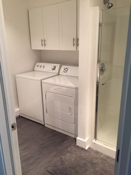 Downstairs full bathroom with washer-dryer