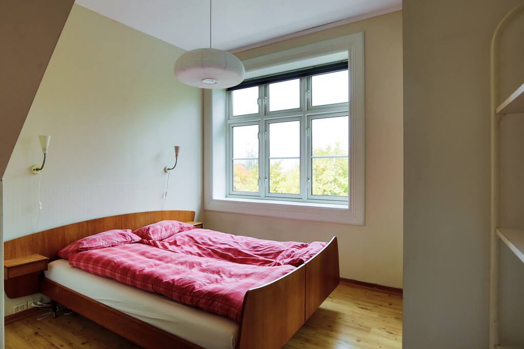 Bedroom with an old fashioned teak double bed with a memory foam mattress and loads of closet space. space for single matress on floor if desired.