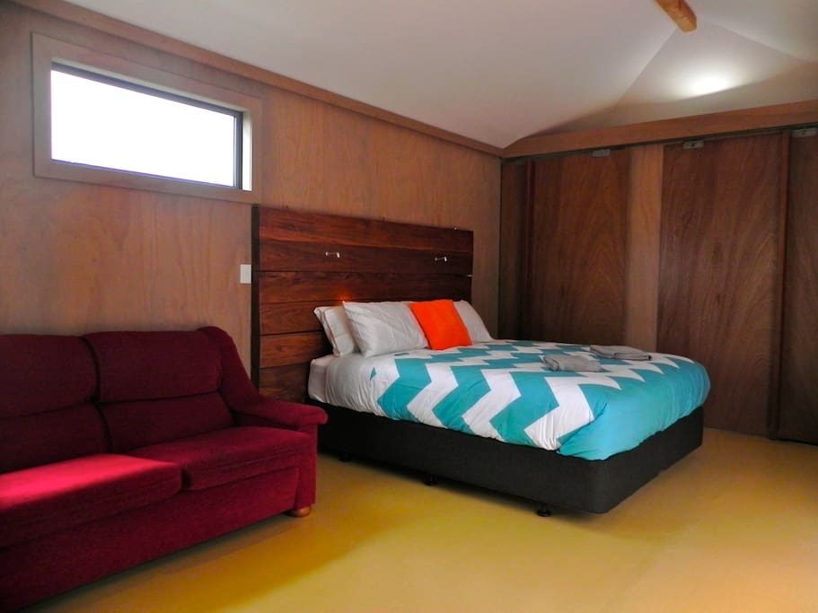 King bed, wood accents throughout