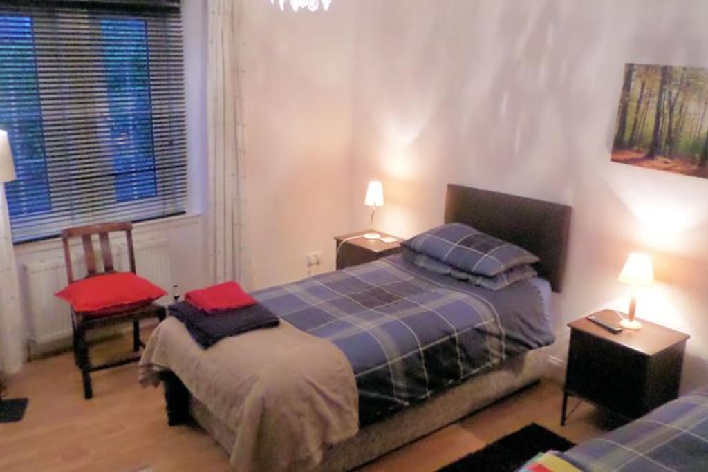 Spacious room with twin beds and TV