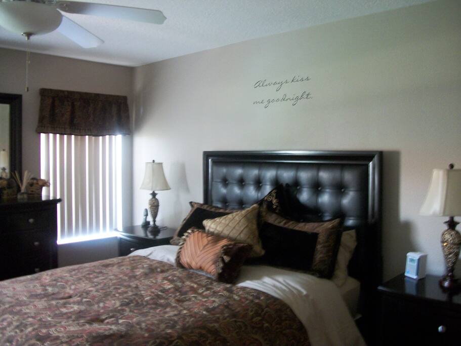 Master Bedroom with Queen size PLUSH mattress and wall mounted TV with en-suite bathroom and walk-in closet