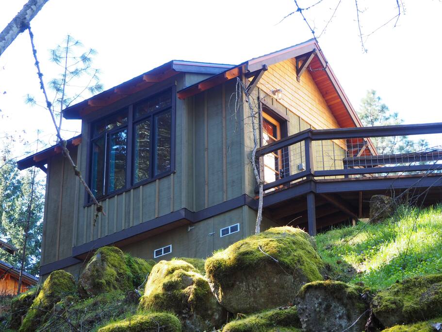 The Cabin sits perched on a hill overlooking the woods