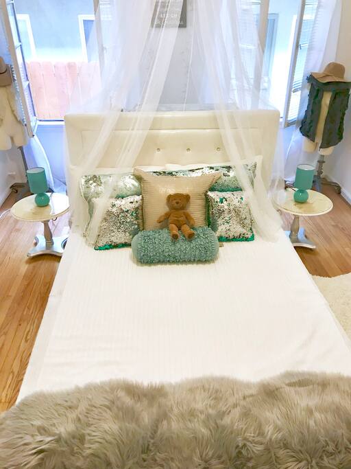 Bed is not in the middle of the room now, its in the corner next to window and with different bed sheets.