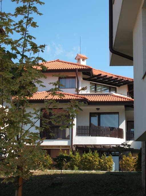 The apartment can be seen at the top of this villa.