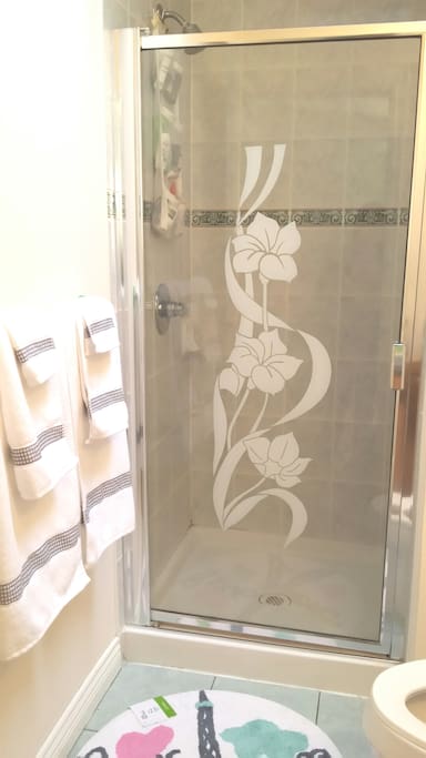 Your private bathroom with towel and shower gel