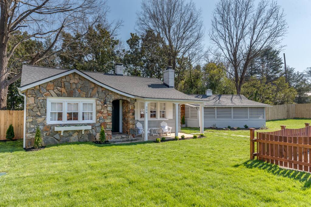 The front porch with Adirondack chairs which can be brought into the front lawn.