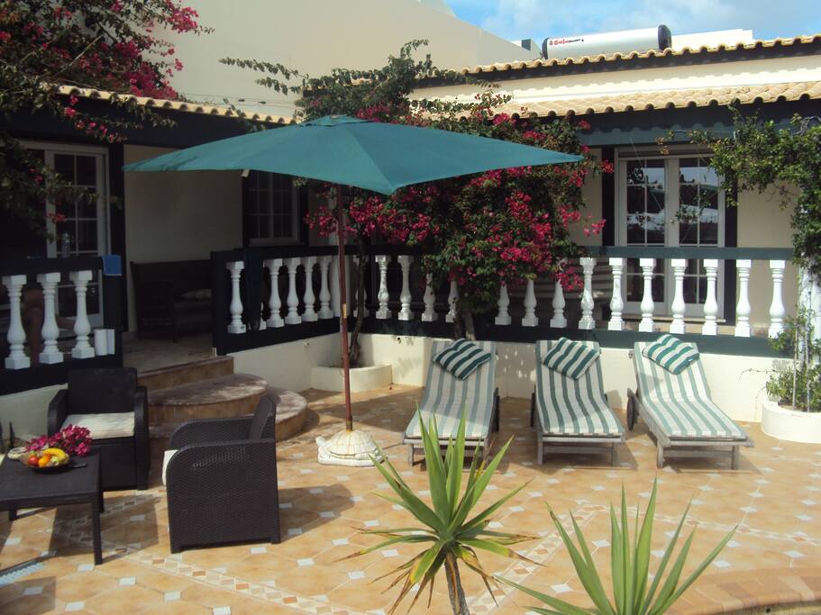 TERRACE AT THE SWIMMING POOL AND JACUZZI.