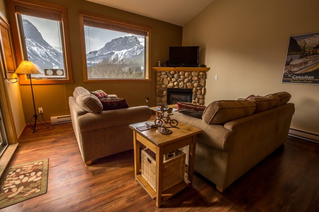Cozy lounge complete with lovely fireplace and stunning views