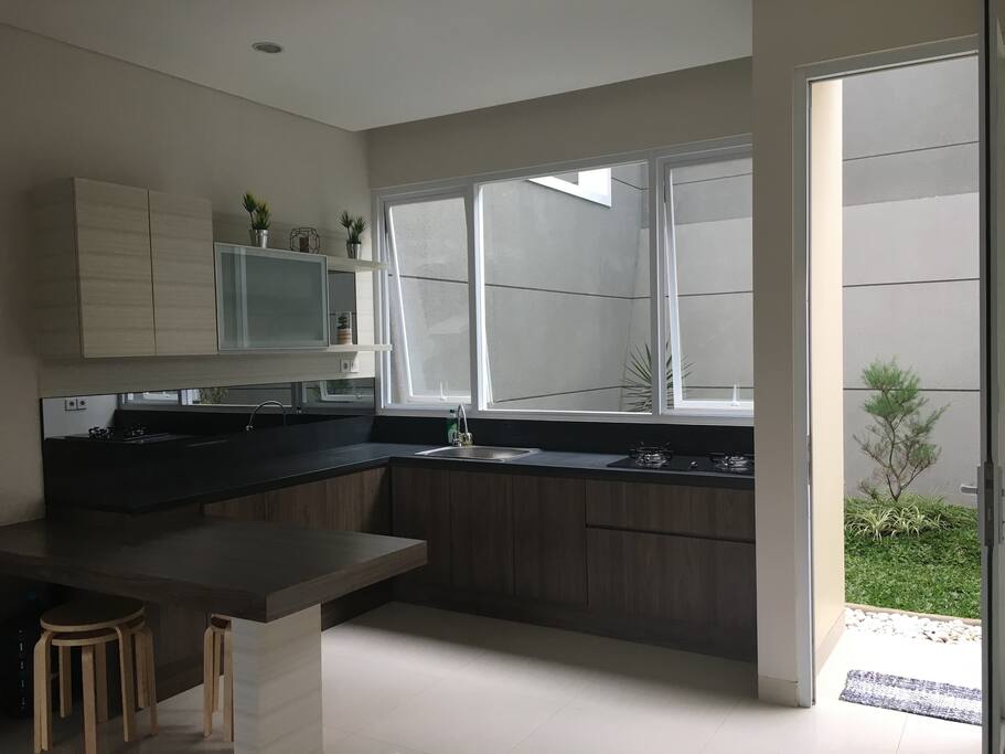 Kitchen set complete with fridge, cookware, and dining ware. (2nd floor)
