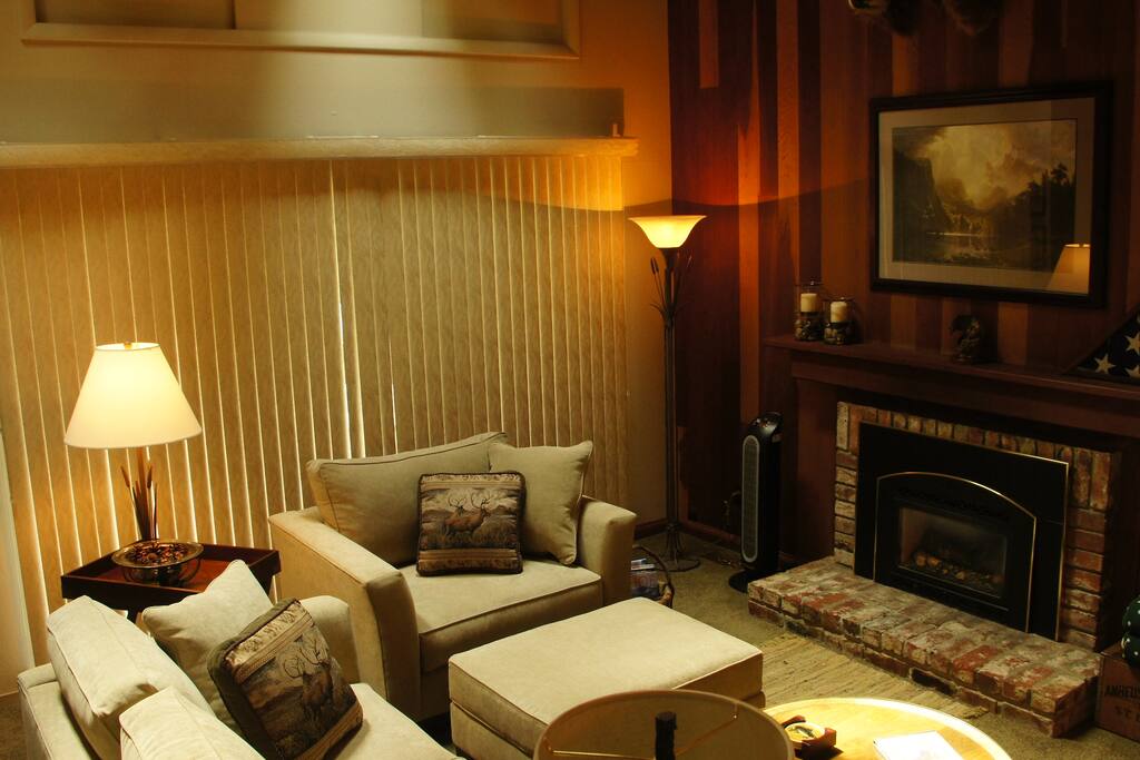 The living room features an instant-on gas fireplace and entertainment center