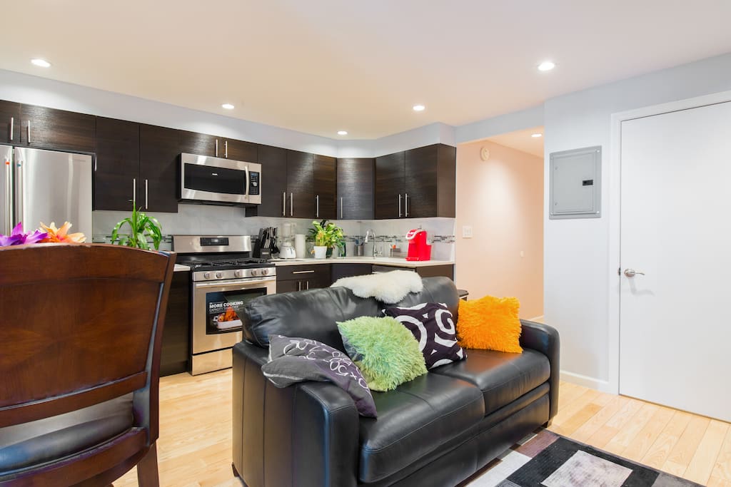 another vantage point with sofa bed and kitchen combo