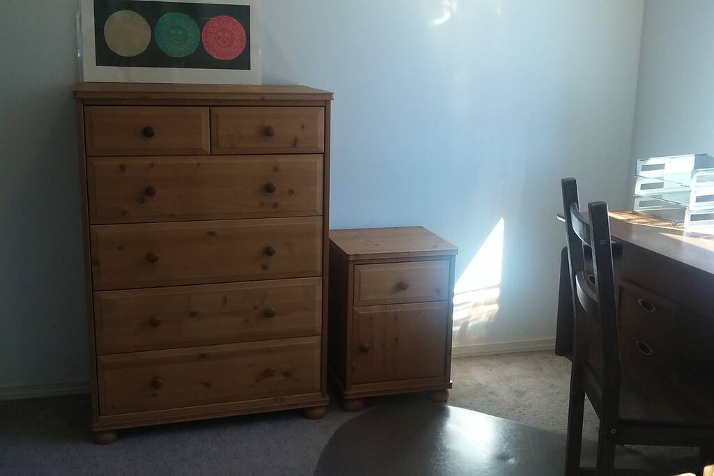 A desk, dresser and nightstand for your convenience.