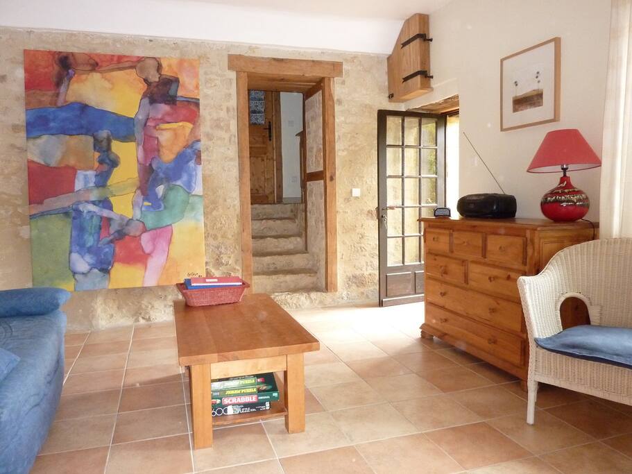The bright salon showing steps to bedroom and bathroom