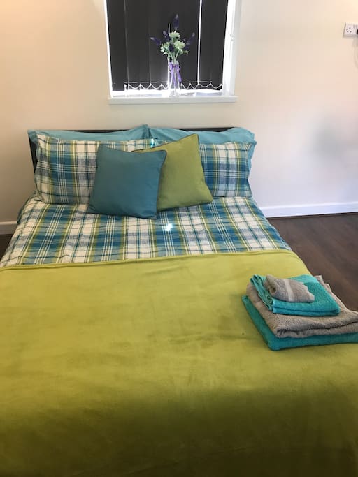 Comfy bed with fresh clean towels