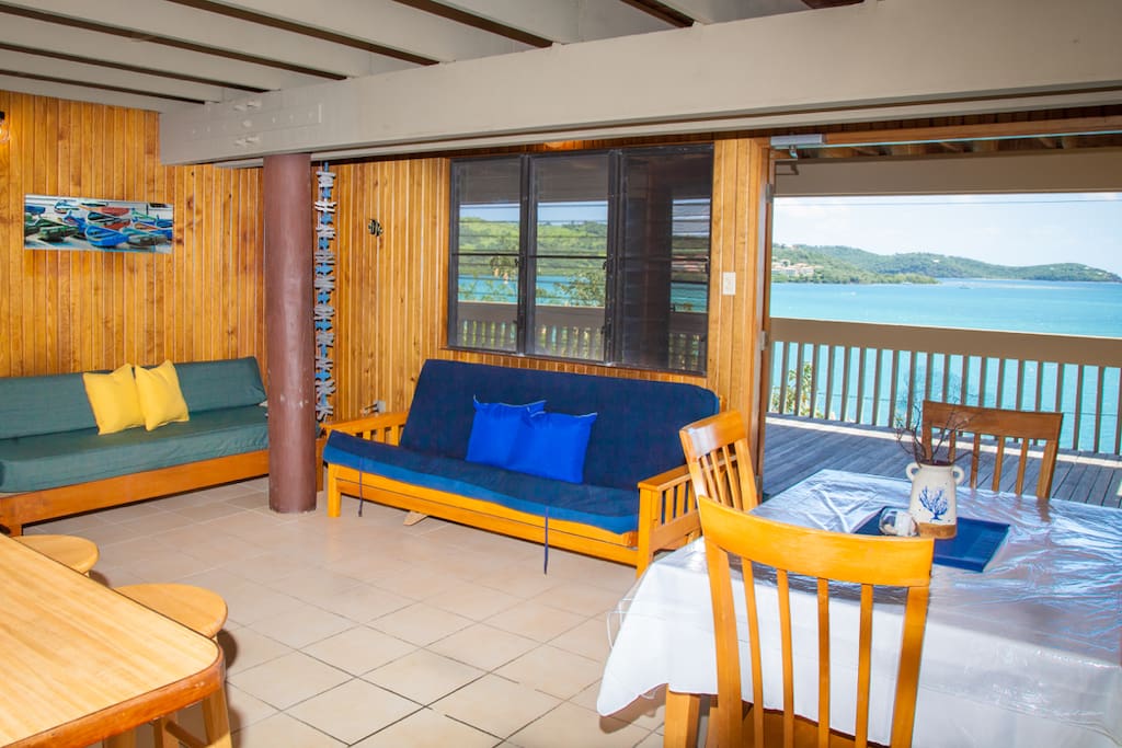 Large living room area with dinning table and Full Size Futon and Twin Size Futon for extra guest.