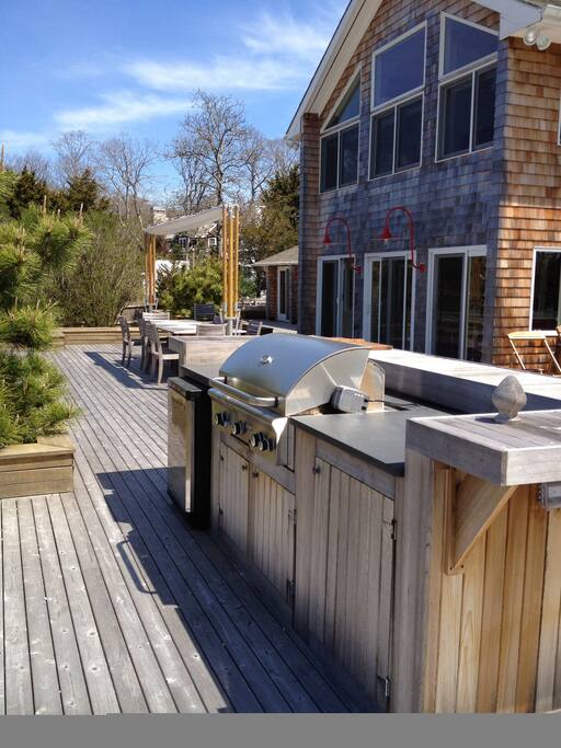 BBQ with island and view of house