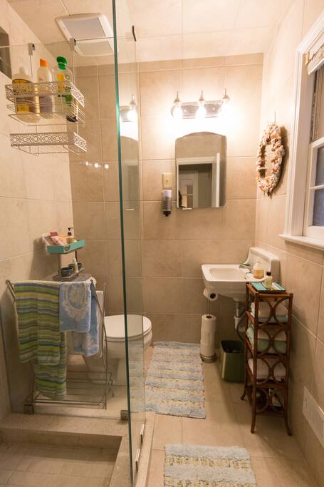 Newly redone tiny bath with shower ensuite.