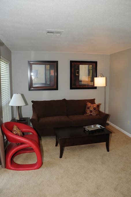 Beautiful Living Room with Custom Queen Sofa Sleeper overlooking the 17th Tee