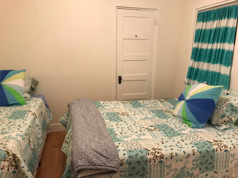 One Queen size bed, one regular twin-bed. Comfortably sleeps 3. There is still the option of a pack and play or sleeper cot for your baby or your under 12 yo sized child.