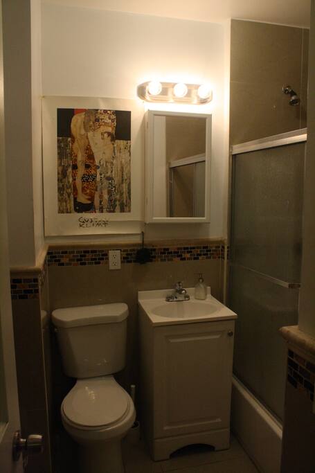 Bathroom with shower and bathtub
