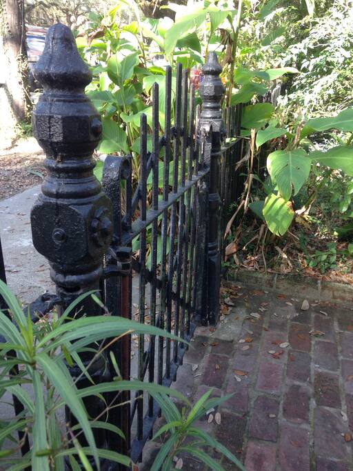 Ornate, historical gate and fence that outlines the front of the house & gardens.
Authentic wrought iron fencing that is original to the home; made in late 1880's.