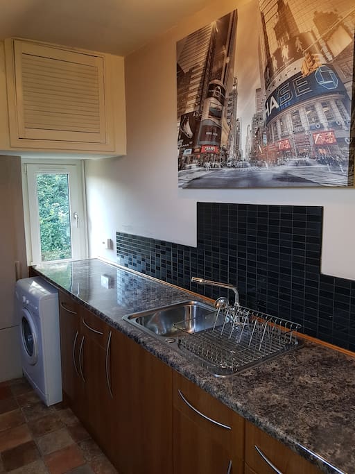 galley kitchen with washing machine
