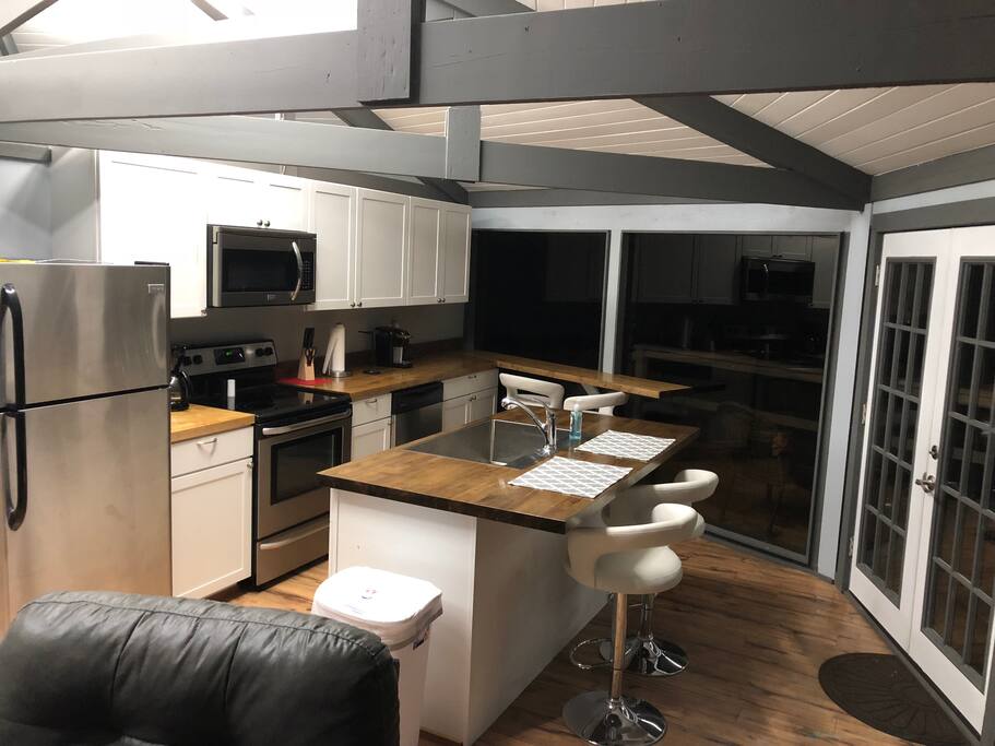 Kitchen that is complete with all cooking ware. Coffee pot, toaster and crock pot.