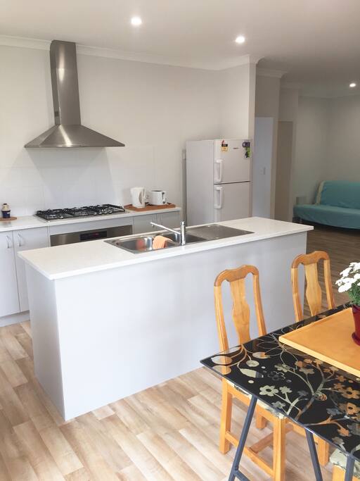 Modern kitchen, large cooker with gas hot plates and electric oven