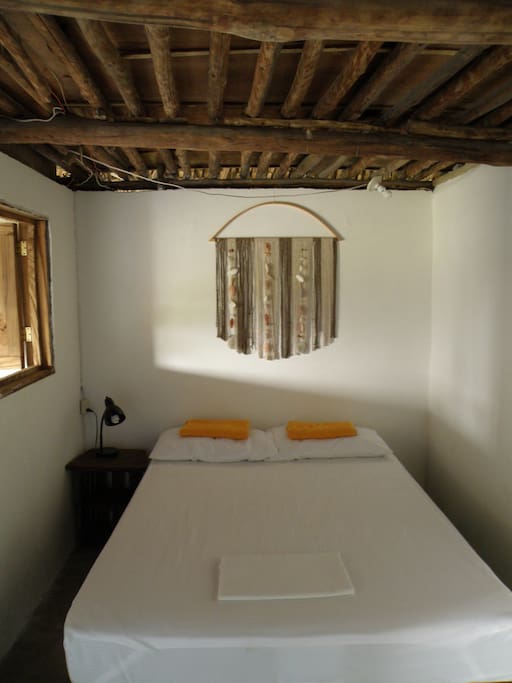 Double bed in second bedroom, next to the private bathroom.