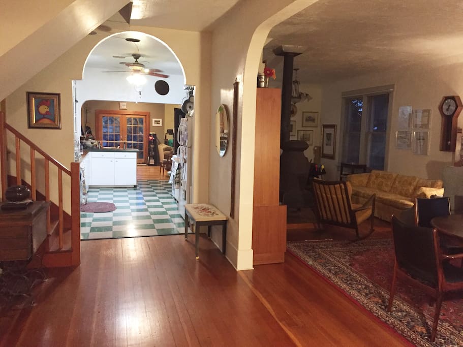 Open floor plan connects front entry through Kitchen or (Right) Living/Dining rooms. Both lead past Pantry w W/D, Breakfast nook, Family room to Garden exit.