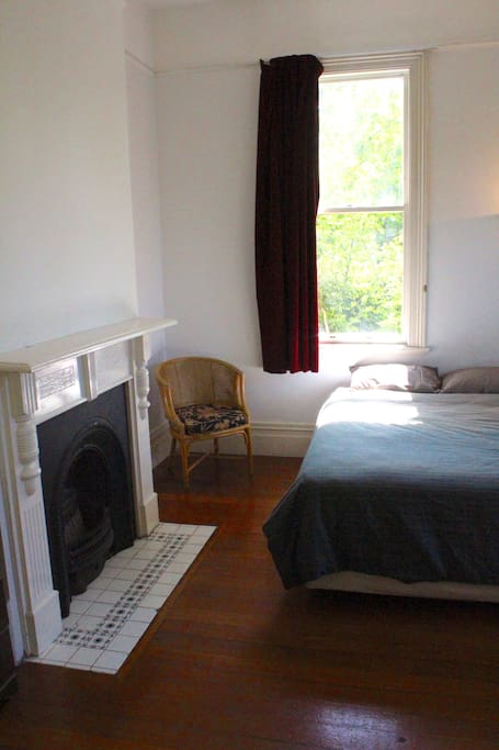 Your room is one of the nicest in the house, featuring a queen bed and grand old fireplace (not in use)