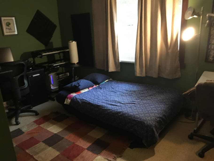 Office converted to bedroom with a double futon.