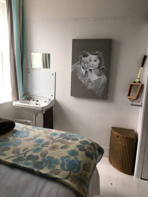 Edwardian sink, mirror, Lloyd Loom linen basket, original painting by Hedley Roberts.