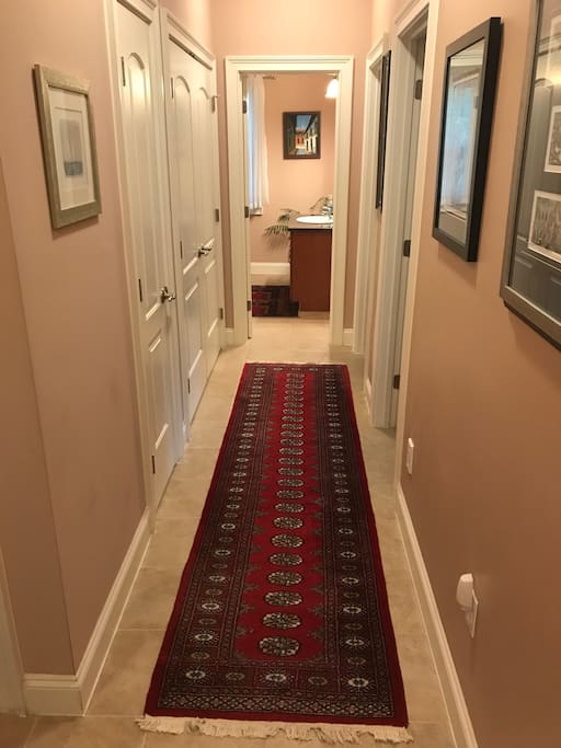 The guest bedrooms are off their own separate hallway; this section of the house has its own full bath and half bath.