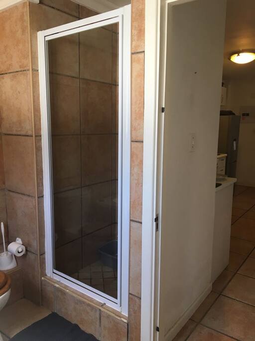 Bathroom includes shower, bath, toilet and 2 basins