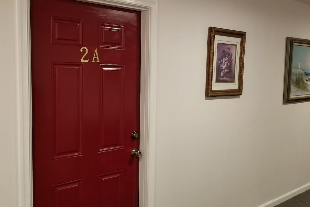 The Airbnb apartment is on the left once you go up the stairs.