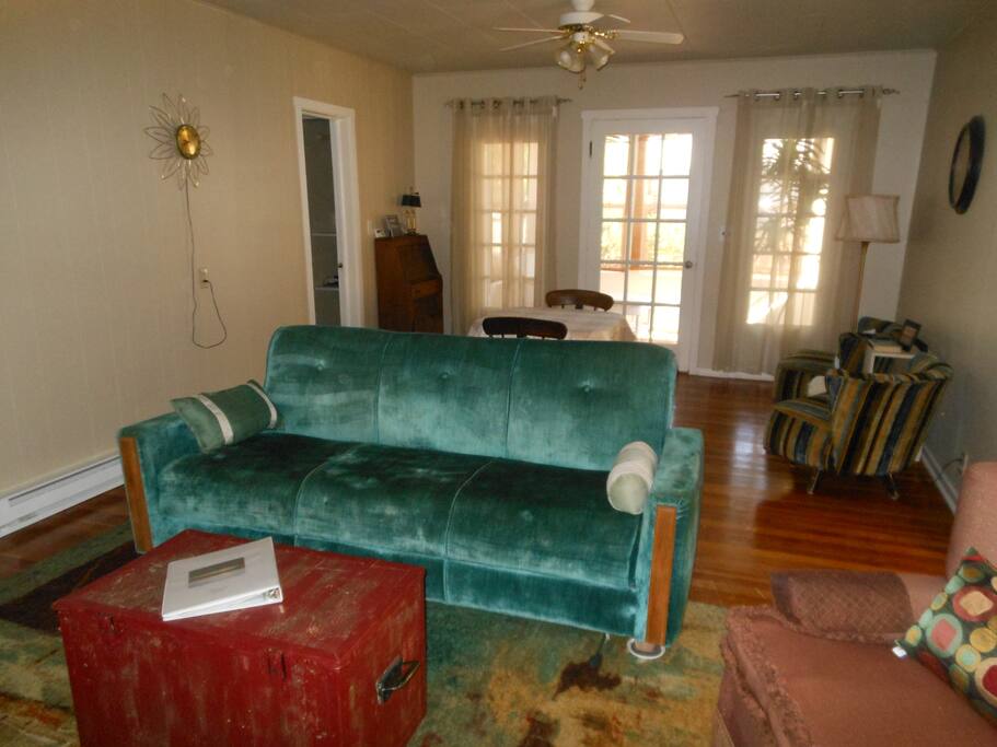Back part of the living room is adjacent to the sun room